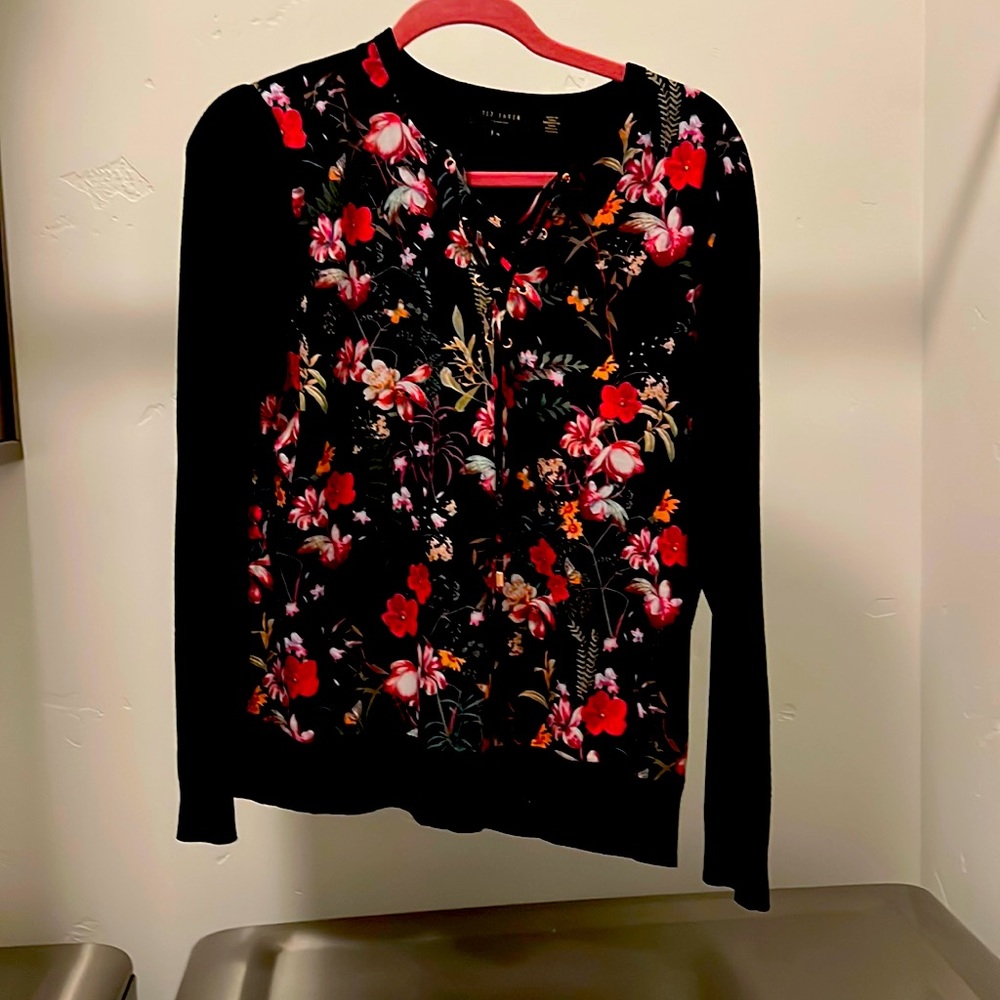 Ted baker floral sweater.top. Floral print on front black on sleeves and back.